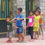 Children play in the street in Phnom Penh, Cambodia