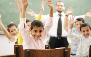 TEFL students really happy with hands up in the air