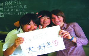 Girls holding TEFL certificate