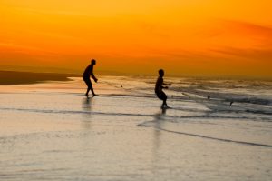 two people fishing in the sea