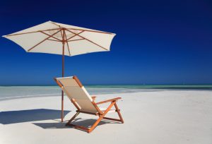 beach chair on a sandy white beach