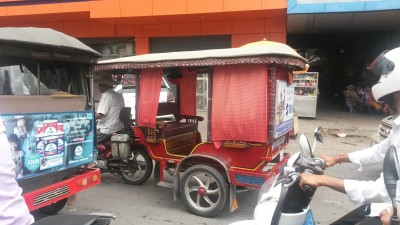 Colourful tuk-tuk transport on the road in Phnom Penh, Cambodia
