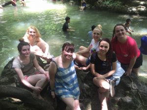 i-to-i TEFL interns sitting at Erawan falls in Kanchanaburi, Thailand