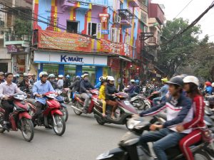 Crowds of motorbikes and mopeds on the street in Hanoi, Vietnam