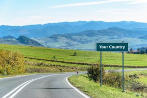 landscape image of mountains and the sign your country