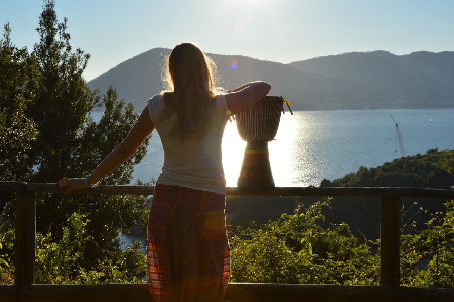 Woman looking out on Lake reflecting on life