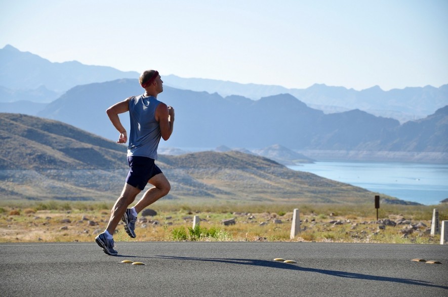 Person jogging with inspiring mountain landscape 