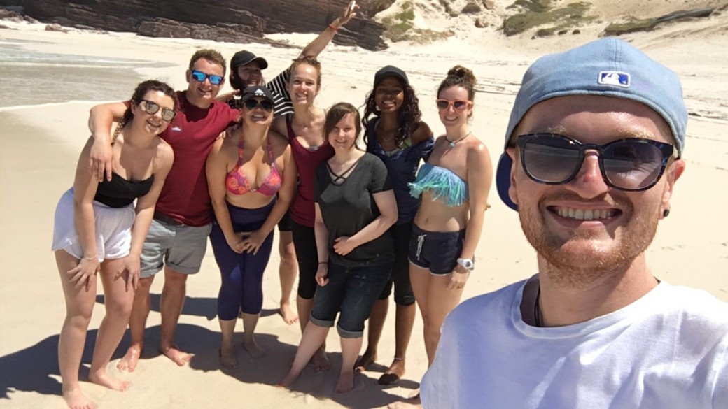 TEFL intern Ross with fellow interns on a beach in South Africa