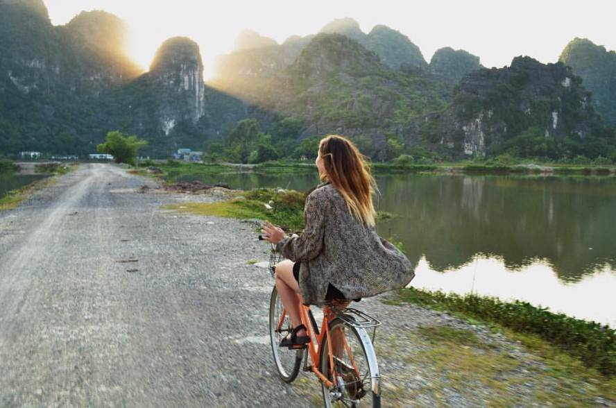 Woman riding a bike in Vietnam 