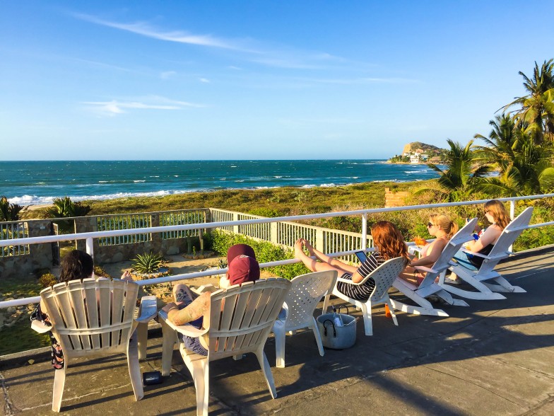 TEFL interns relaxing at the beach house after a day teaching