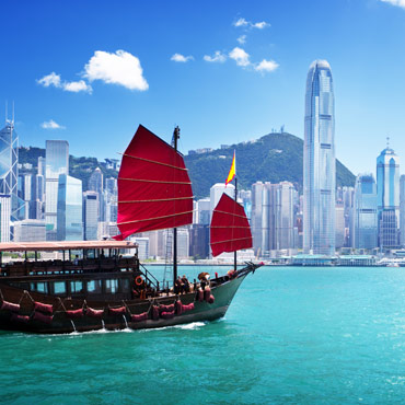 boat next to Chinese city scape