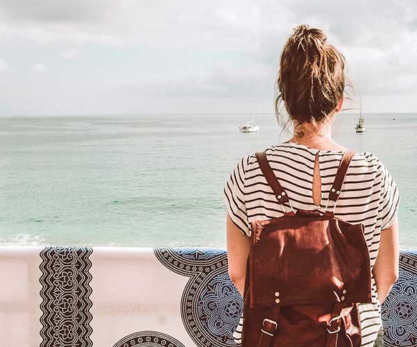 A girl travelling looking out to sea