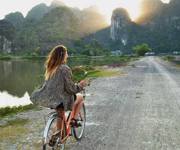 A girl cycling in Vietnam