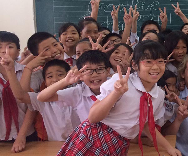 asian school children posing in classroom