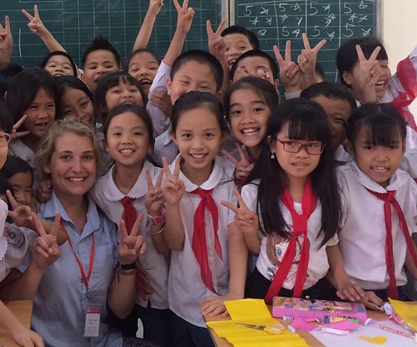 asian school children posing in classroom