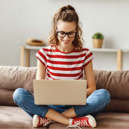 woman smiling on laptop