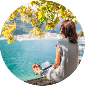 Girl sat on wall in Spain