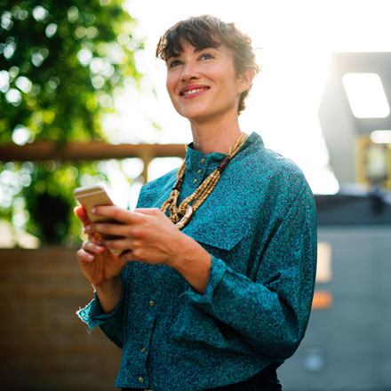 Woman smiling with phone