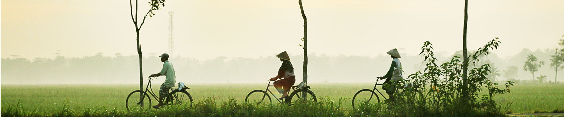 WOman riding a bike in Indonesia