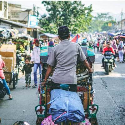 Indonesian street, man on TukTuk