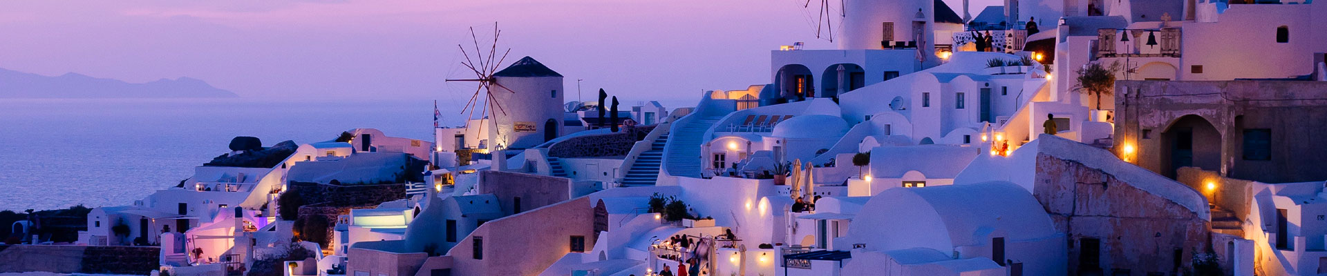 White buildings with a purple glow in Greece