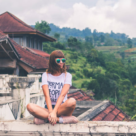 Female traveller on wall