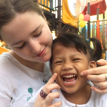 Maddie with smiling student