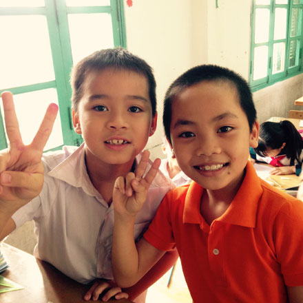Two students smiling