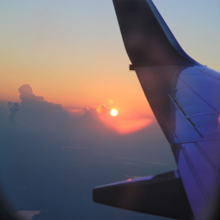 Sunset out of plane window