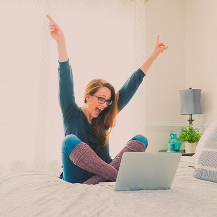 Happy woman on laptop