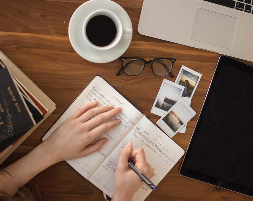 woman writing in a book