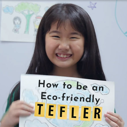 Young girl holding eco-friendly poster