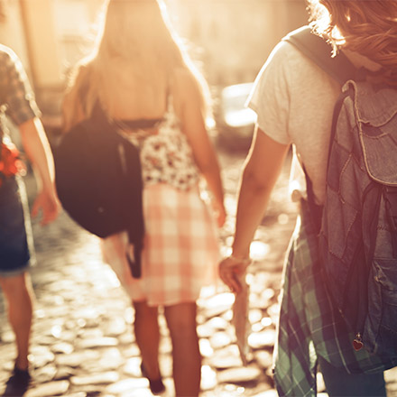 Friends walking together from behind