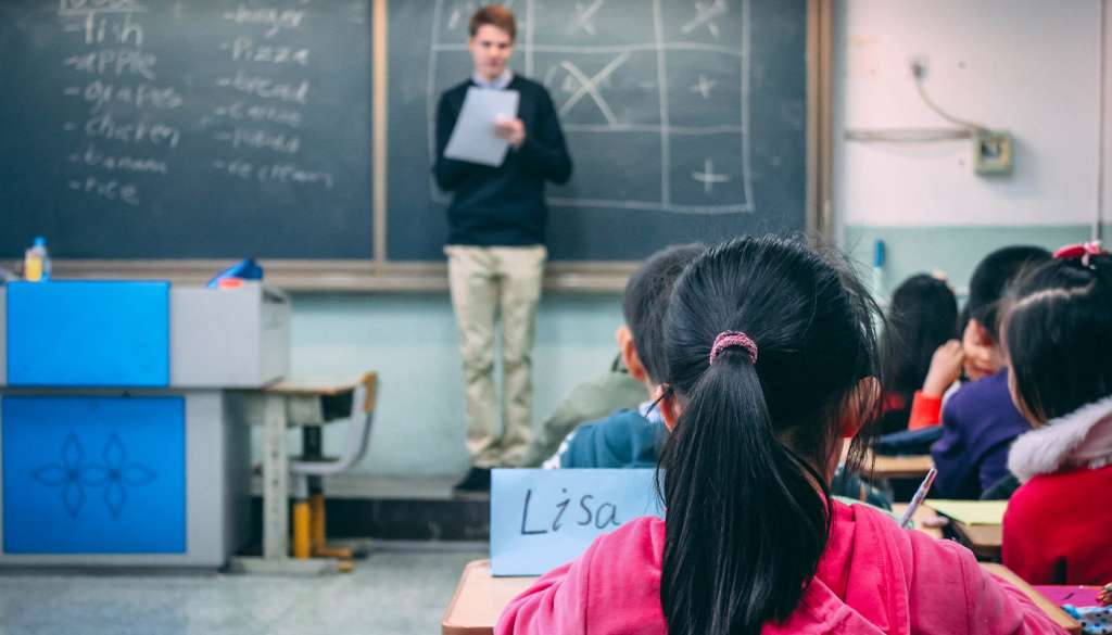 TEFL teacher stood at the front of classroom - China