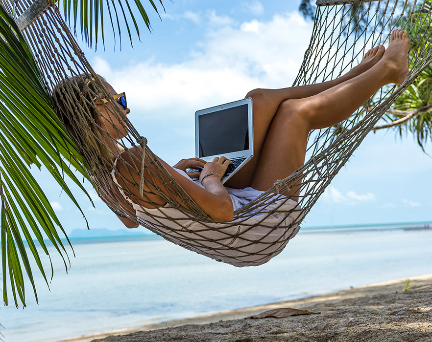 Woman in hammock with laptop