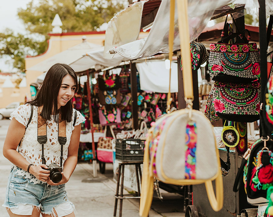 Woman taking picture at Mexican market