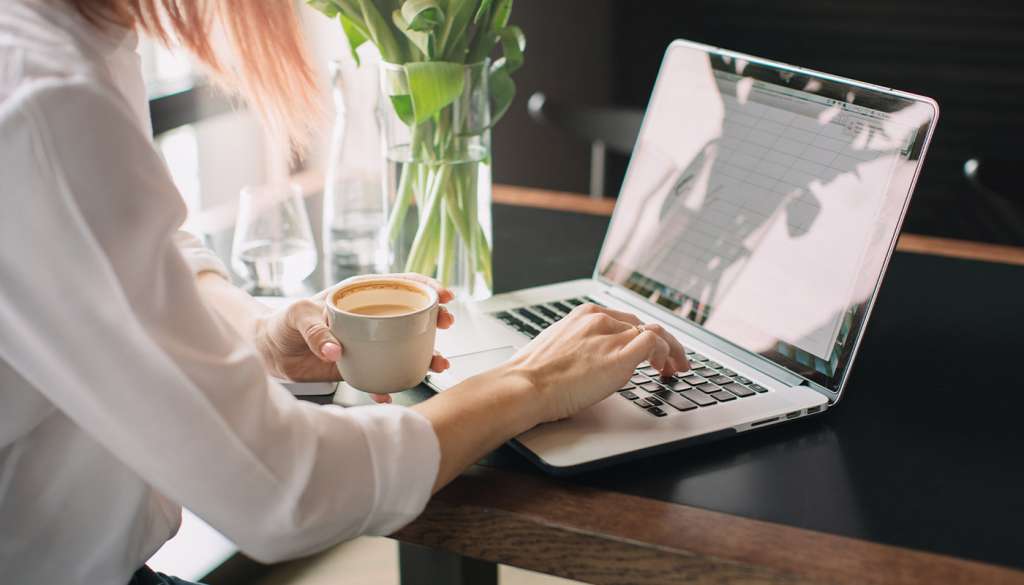 Woman typing on laptop