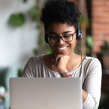 woman using laptop to do tefl course