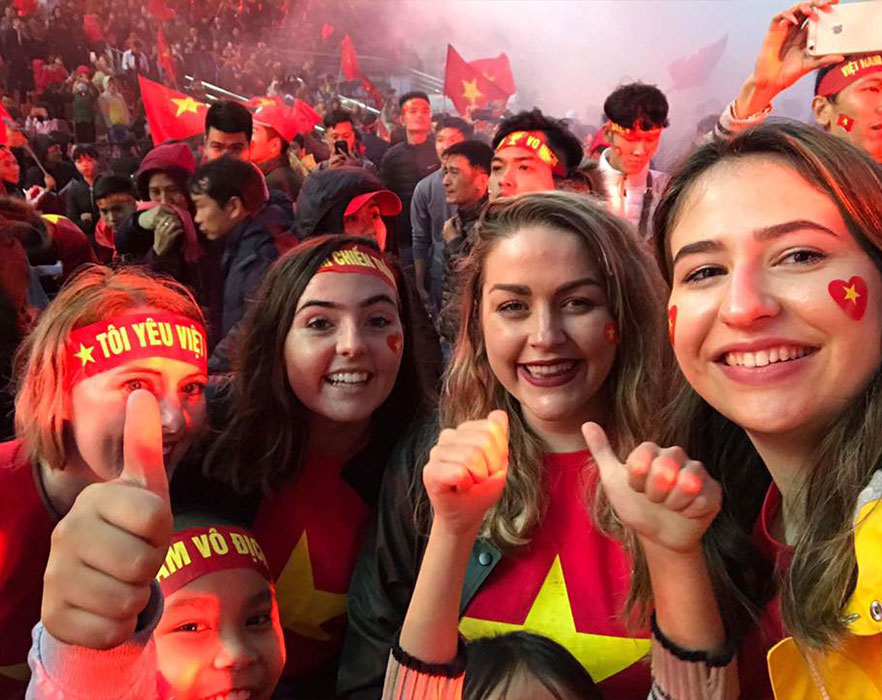 TEFL teachers with students at Vietnamese football match