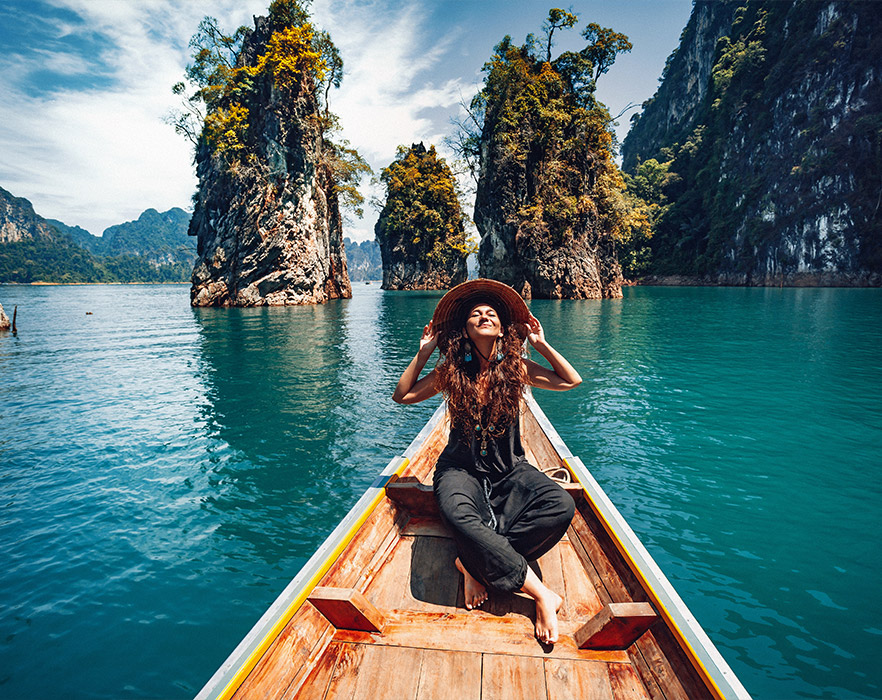 Woman sat on boat in Thailand