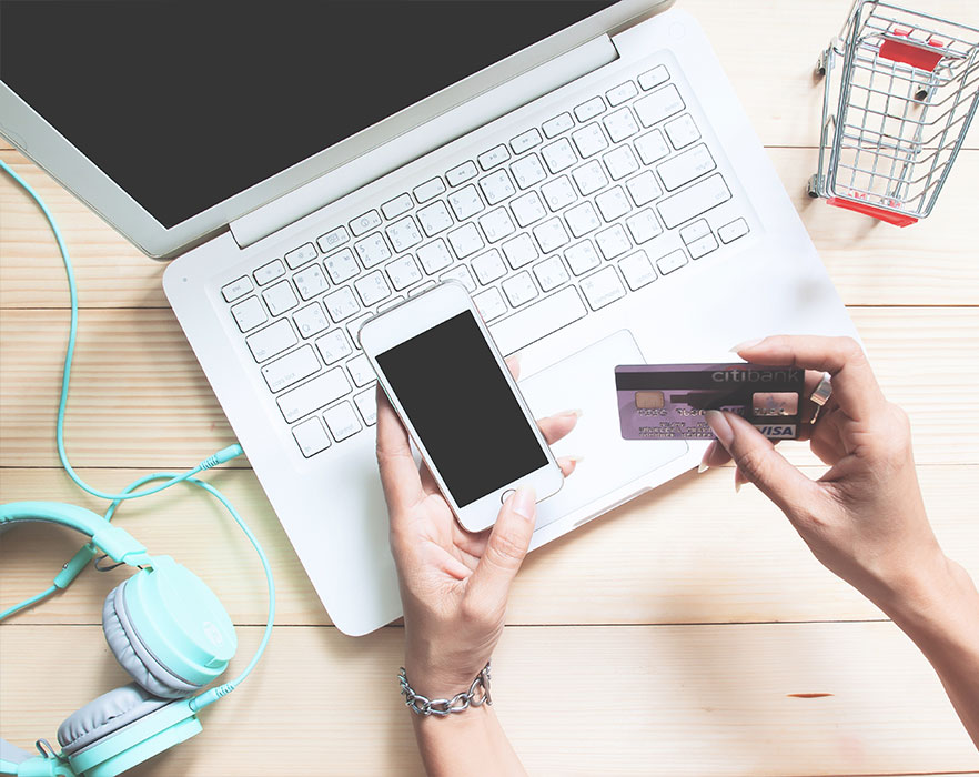 Woman using card to make online payment