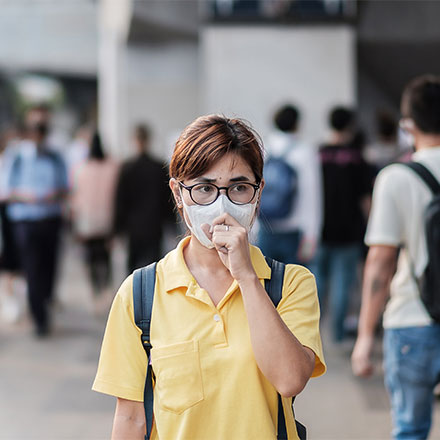 Woman wearing protective mask, China