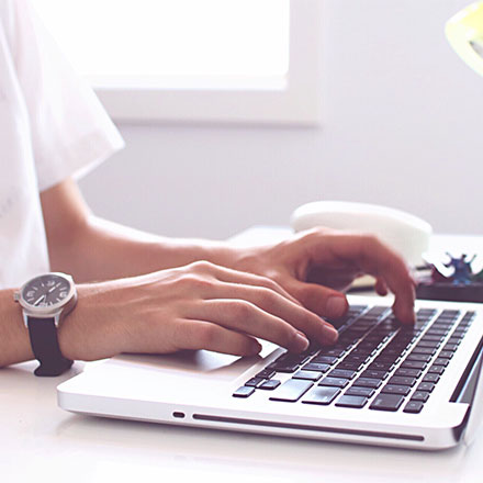 Person typing on laptop