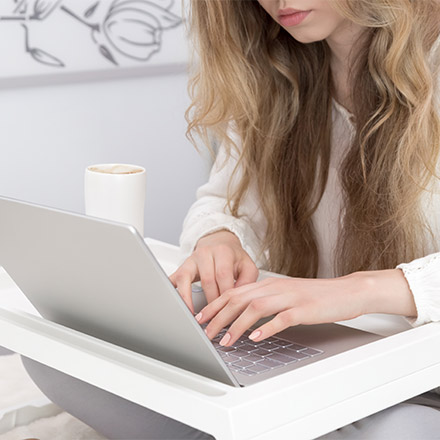 Woman typing on laptop