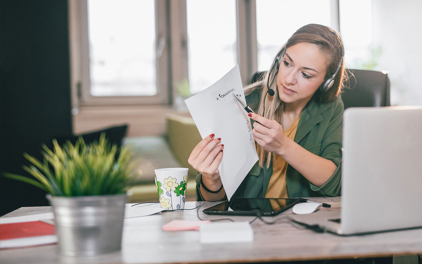 Woman teaching online using laptop