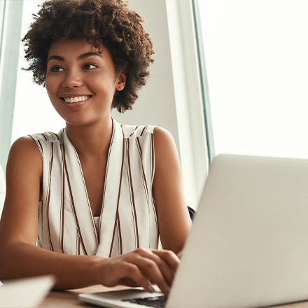 Woman typing on laptop