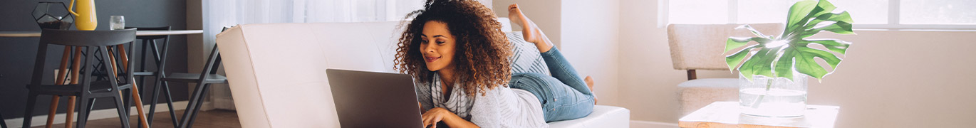 Girl on laptop in apartment