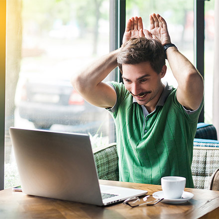 Man using laptop to teach English online