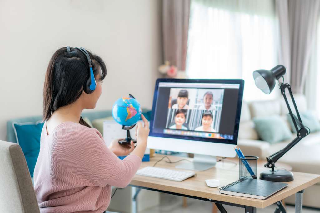 woman teaching group class on laptop