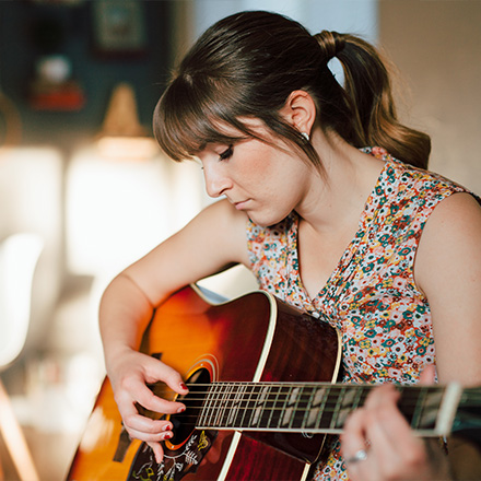 Woman playing guitar